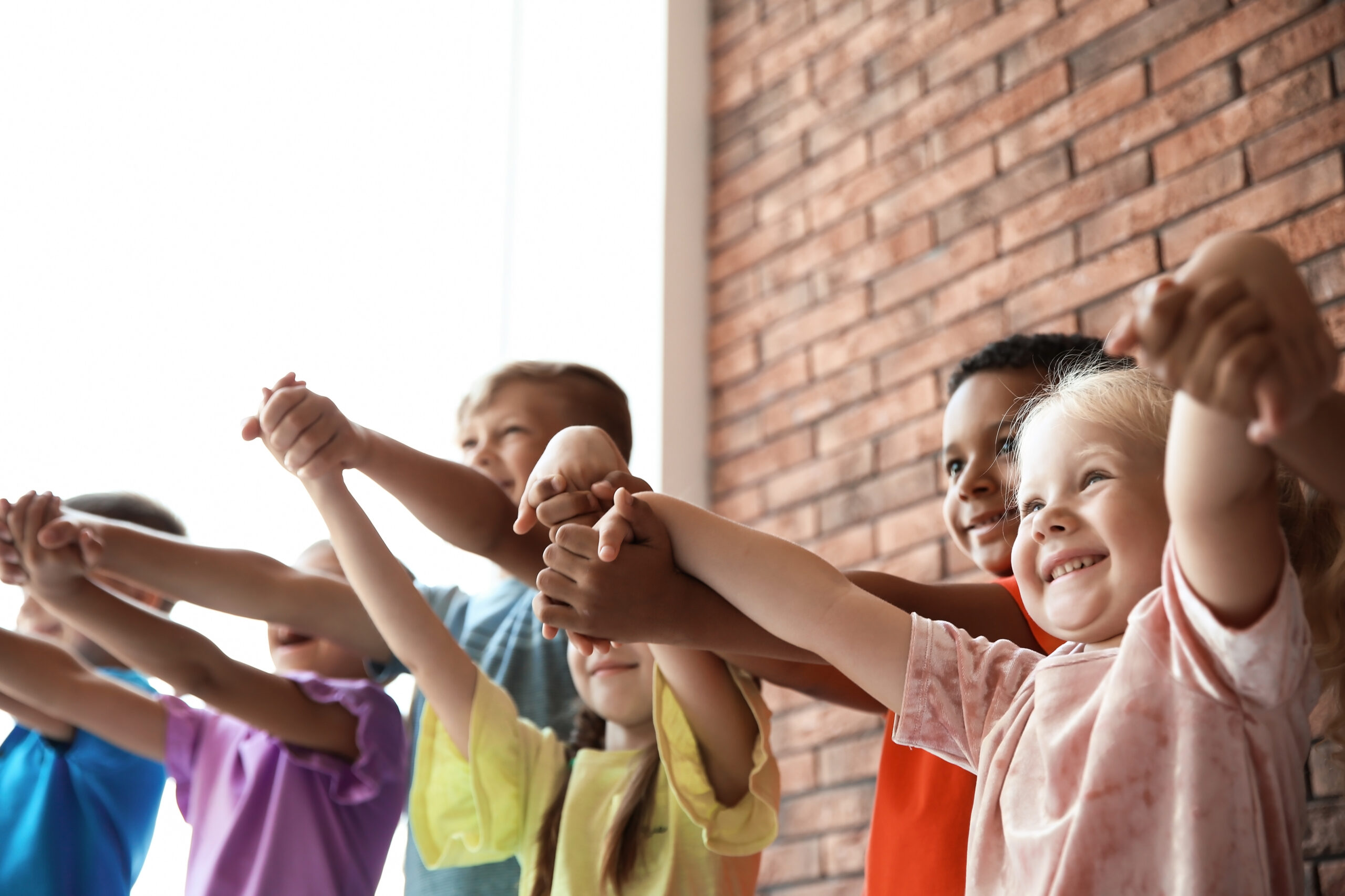 Little,Children,Holding,Hands,Together,Indoors.,Unity,Concept