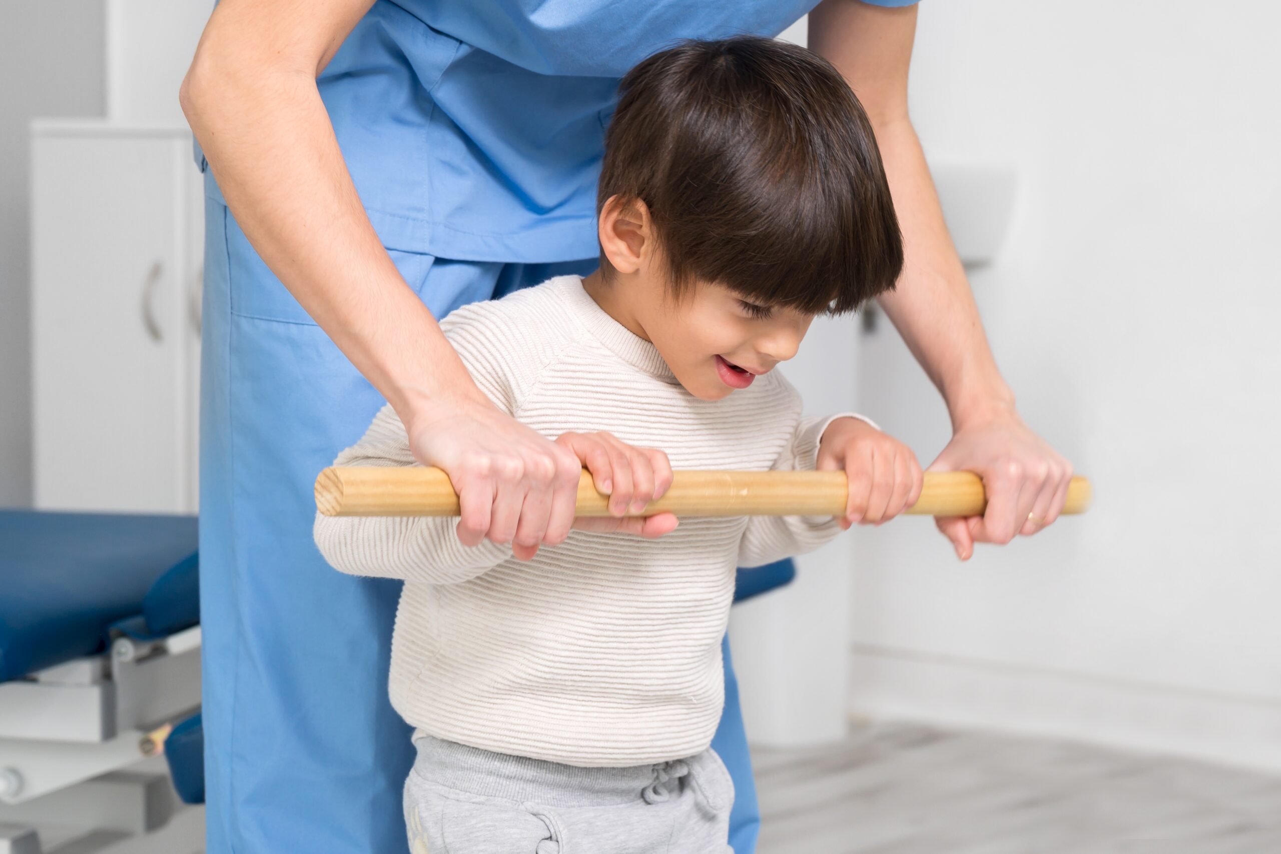 Physiotherapist,And,Kid,Walking,In,Rehabilitation,Center.,Doctor,Supports,A