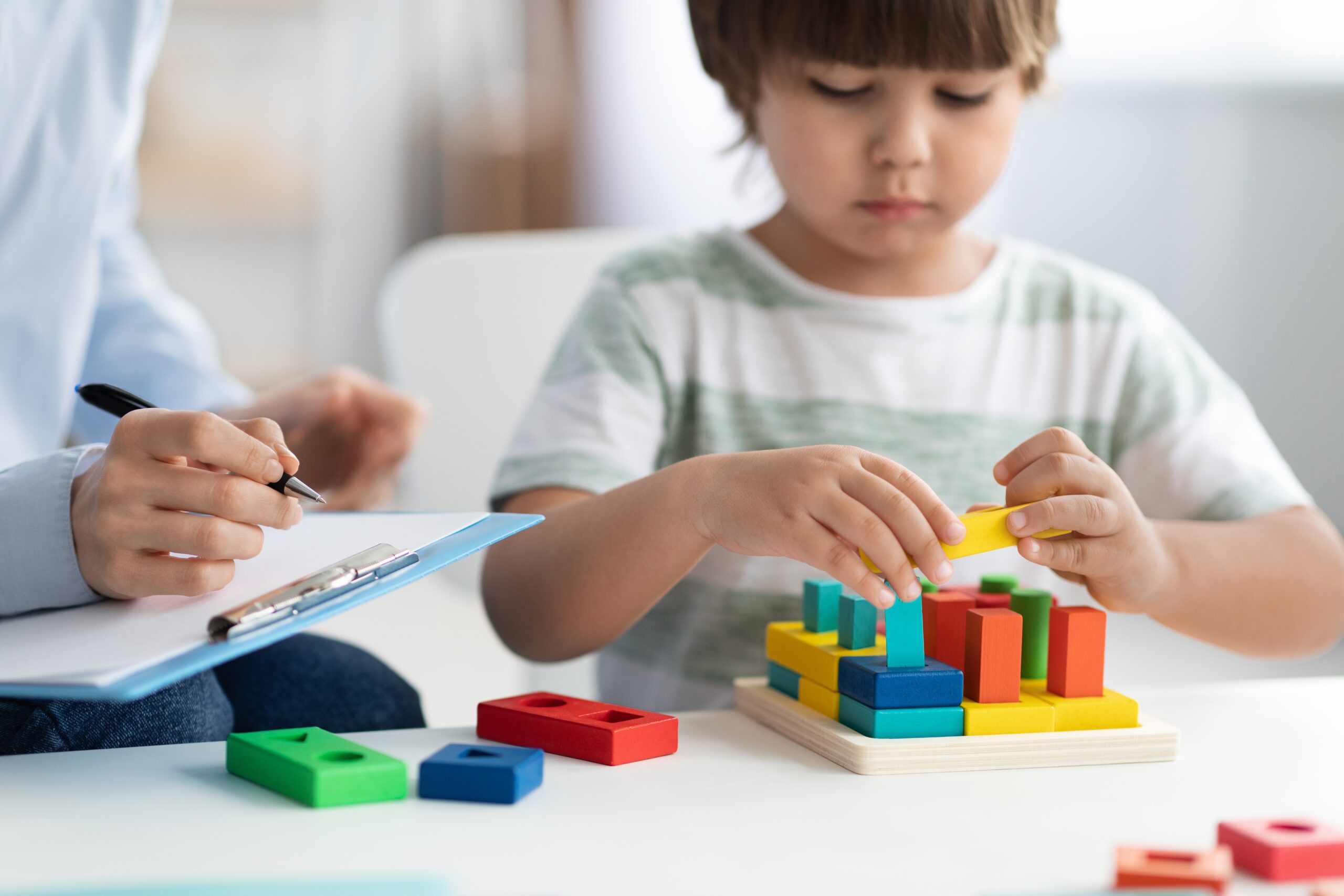 Close,Up,Portrait,Of,Cute,Little,Boy,During,Play,Therapy